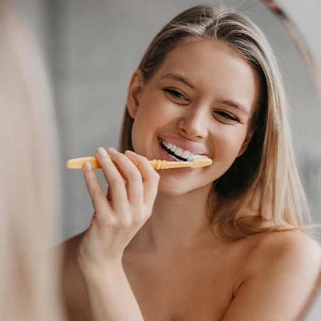 Woman brushing her teeth