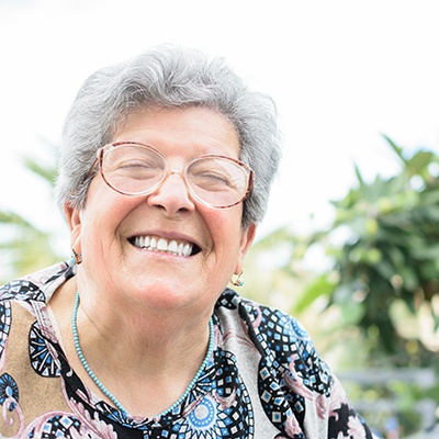 Woman with dentures smiling