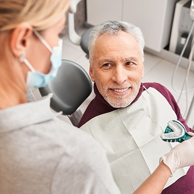 An older man receiving dental impressions for dentures