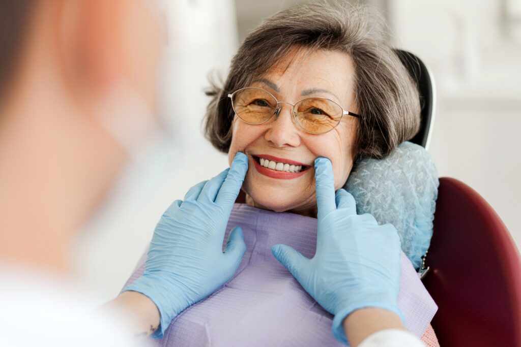 Dentist looking at patient's smile